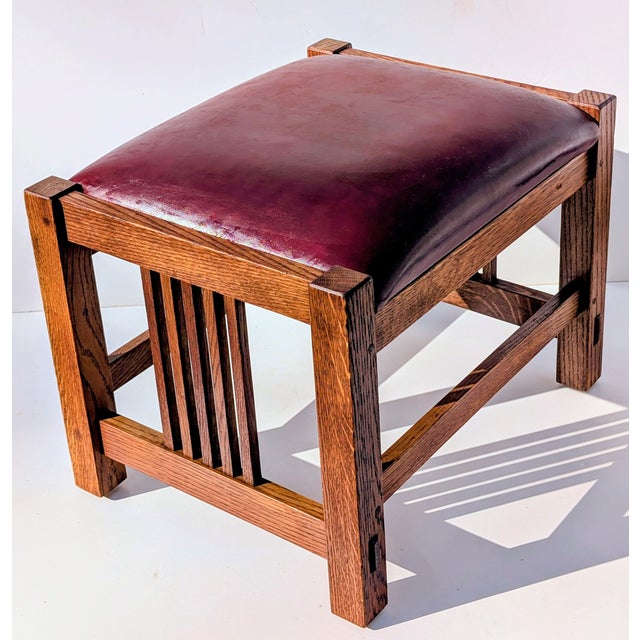 This authentic Stickley Mission Collection footstool is a masterclass in American Arts and Crafts design. Crafted from...