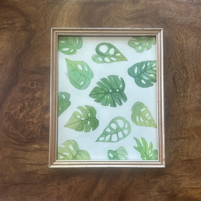 A playful yet calming composition of various monstera leaves in soft green hues. The repetition and subtle color...