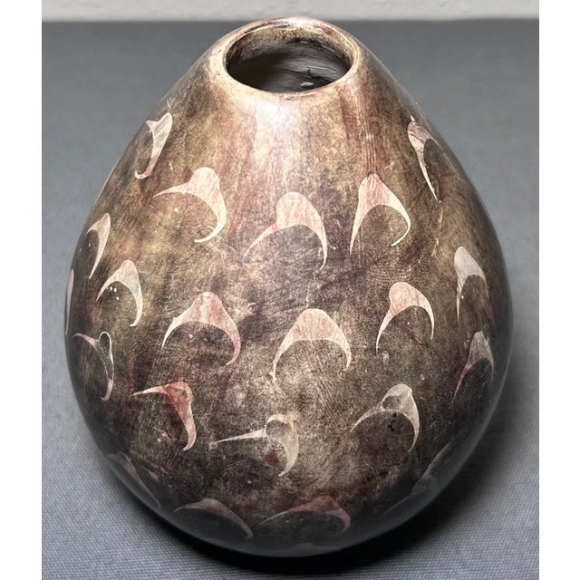 Up for sale is a Vintage 1994 Peruvian Maneno Studio Pottery Brown/White Clay Vase! It measures 5” tall. The piece is in...