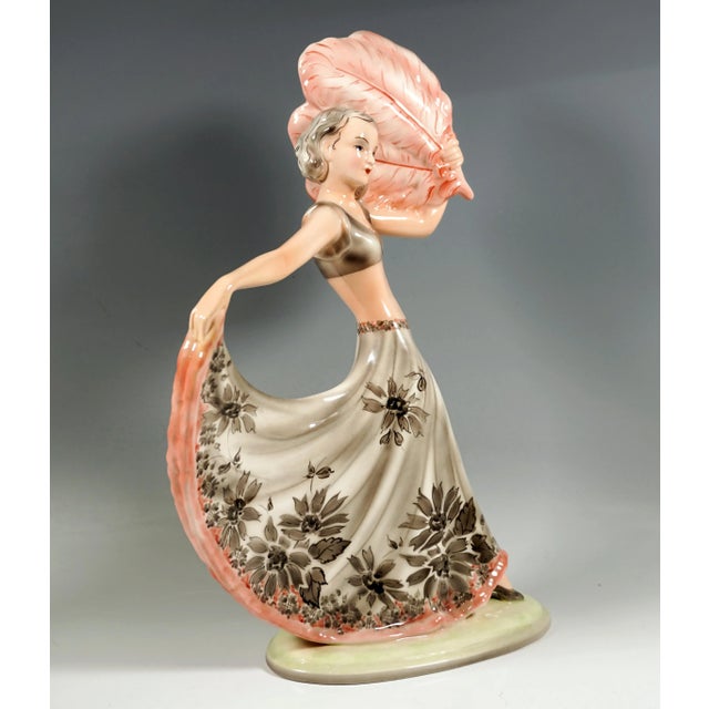 Elegant goldscheider art deco ceramic figure of the 1930's: dancer with shoulder-length hair in a long, wide, light gray...