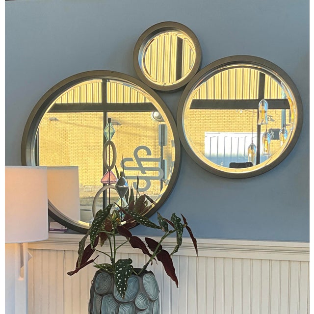 The Gable 3-Ring Mirror is a sculptural accent piece that blends artistry with everyday function. Composed of three...