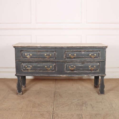 Early 18th century English silhouette leg pine dresser base with four drawers and a painted faux marble top. 1730....
