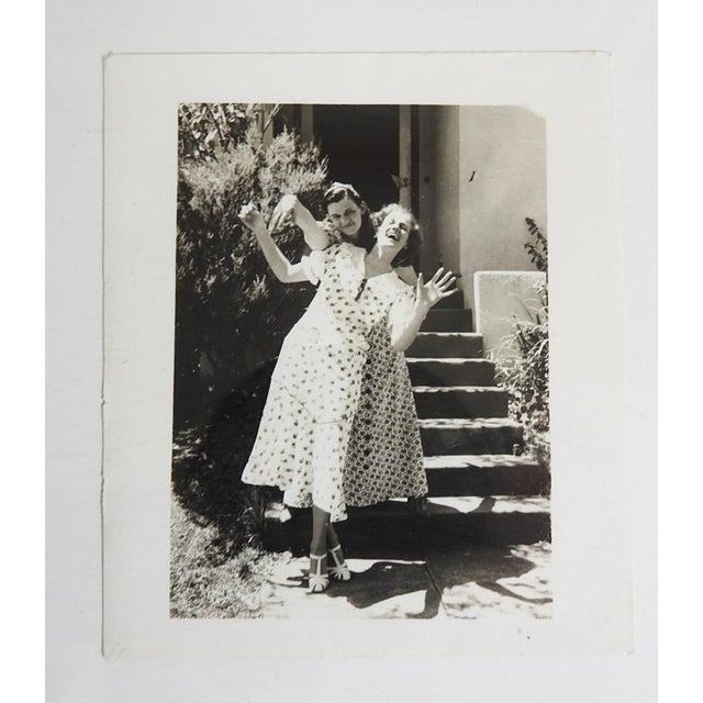 Circa 1930's snapshot photograph of two women being silly. Unframed.
