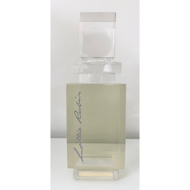 Large lucite perfume bottle for the signature fragrance from Lillie Rubin, a luxury fashion brand. This specific...