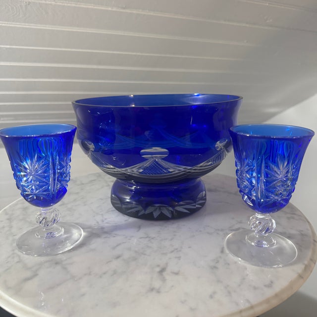 This striking three-piece dessert or serving set features a vibrant cobalt blue cut-to-clear crystal design. The...