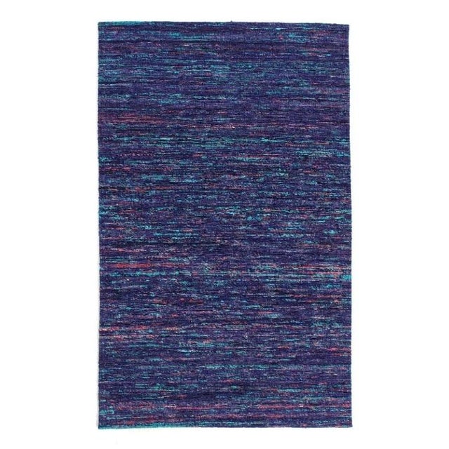 Sari-silk Modern Rug. Hand Tufted. Fine weave. These Modern rugs are sure to add a touch of modern elegance to any room in...