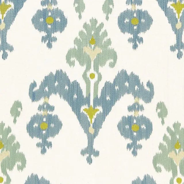 An antique Central Asian silk ikat inspired this beautiful and dramatic design. Silky viscose embroidery evokes the tonal...