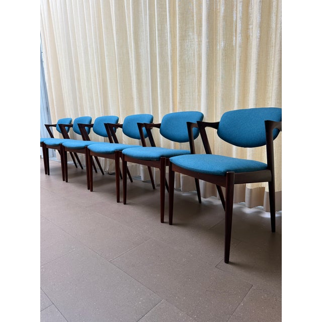 Attributed to Kai Kristiansen Model 42 chair is a celebrated icon of Danish modern design, renowned for its sculptural...