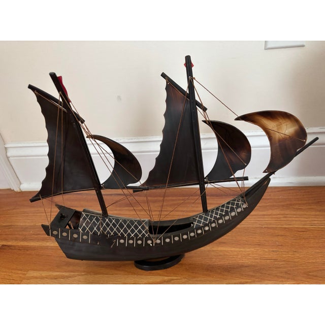 An intricate, vintage mid-20th-century nautical sculpture crafted entirely from polished, natural water buffalo horn. This...