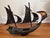 An intricate, vintage mid-20th-century nautical sculpture crafted entirely from polished, natural water buffalo horn. This...