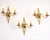 Set of three matching brass wall sconces dating to the 1960s, in a geometric French decorative style. Each sconce has a...