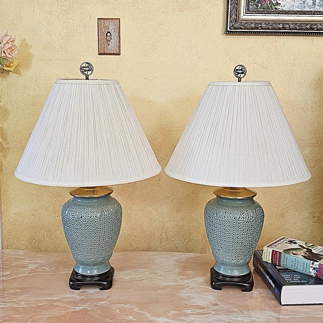 Beautiful pair of vintage Chinoiserie-style reticulated celadon porcelain table lamps with elegant pierced latticework and...