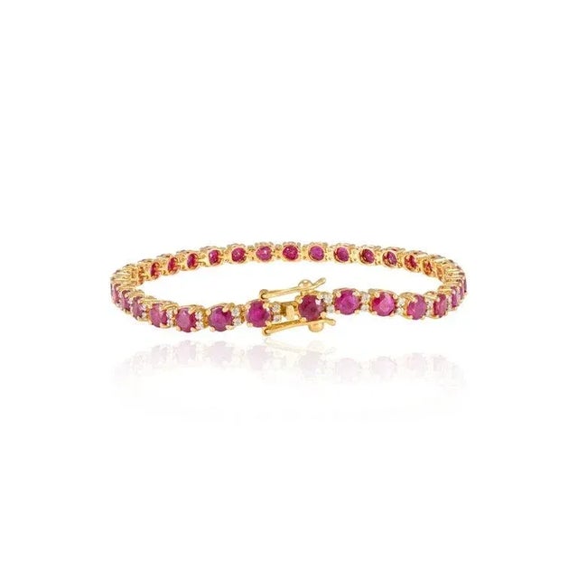 This is part of Chairish’s Fine Jewelry assortment. This Natural Ruby and Diamond Tennis Bracelet in 18K gold showcases...