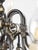 Two-tier, 12-arm Flemish-style chandelier. The upper section features a Flemish eagle motif, while the arms are decorated...