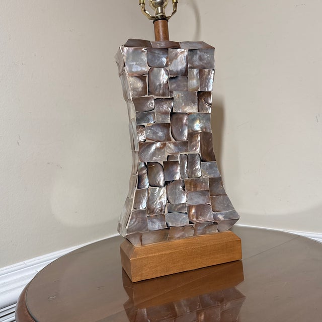 This is a stunning vintage or mid-century modern table lamp featuring a pedestal base covered in an intricate mosaic of...