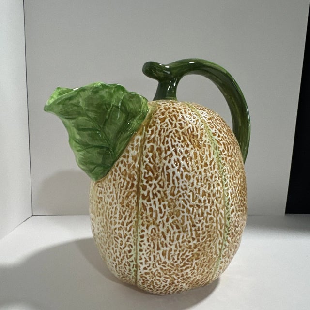 Bring a touch of whimsical charm to your home with this **Vintage The Haldon Group Ceramic Cantaloupe Melon Pitcher**....