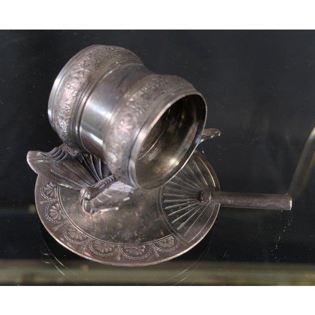 This Victorian silverplate napkin ring by Rogers & Bros is a fine example of the Aesthetic Movement's enthusiasm for...