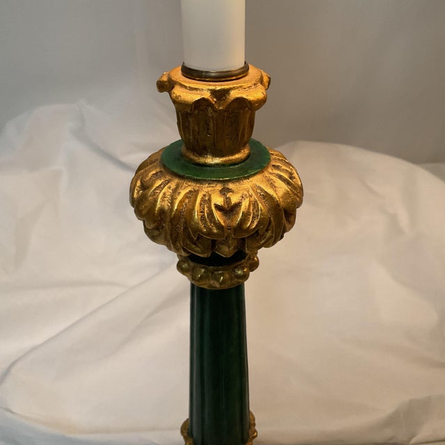 Add timeless elegance to your space with this beautiful pair of table lamps featuring a rich green base accented with...
