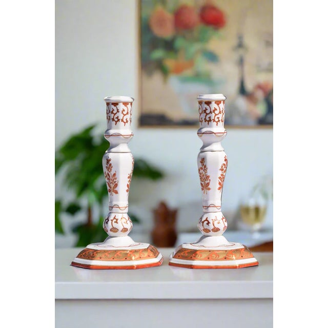 Title: Pair of Italian Porcelain Candlesticks, Iron-Red and Gilt Era: Mid-20th Century (c. 1940s–1960s) Style: Meissen...