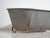 Antique galvanized zinc bathtub with iron structure, originating from Central Europe, circa 1900. This type of metal tub...