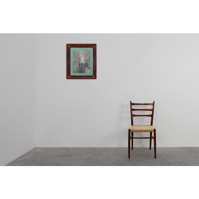 An elegant late‑19th‑century French frame in richly figured walnut, adorned with finely cast bronze corner ornaments. The...