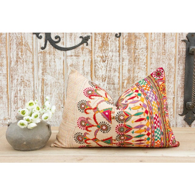 These colorful throw pillows are made from Rabari tribal dowry bags. The embroidery is on cotton and has intricate chain...