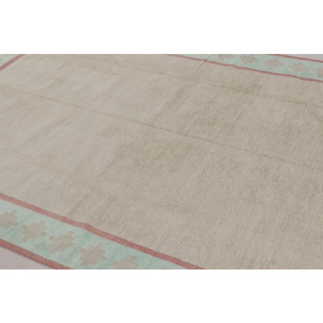 This 6x9 Dhurrie rug represents an exciting contemporary flatweave collection from Rug & Kilim—a modern take on antique...