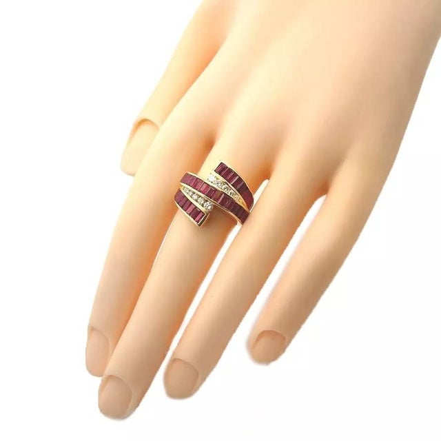 This gorgeous Estate band ring is crafted from 18k yellow gold. The front half of the band has 5 rows, the center a full...