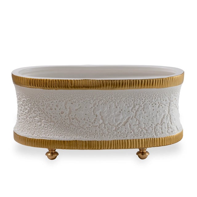 Modern and textural describe our Bruner collection of accessories and containers. Cream white glaze is accented with...
