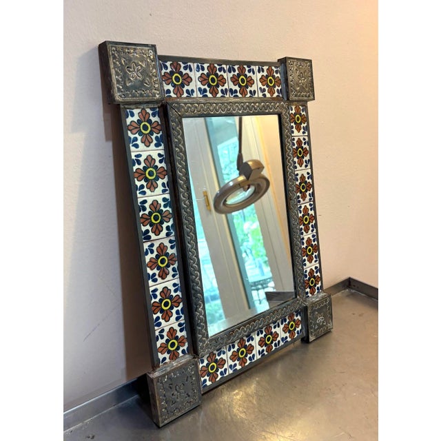 1940s-50s Mexican punched tin & hand-painted tile wall mirror. Excellent condition. Measures 17" x 13" including frame.