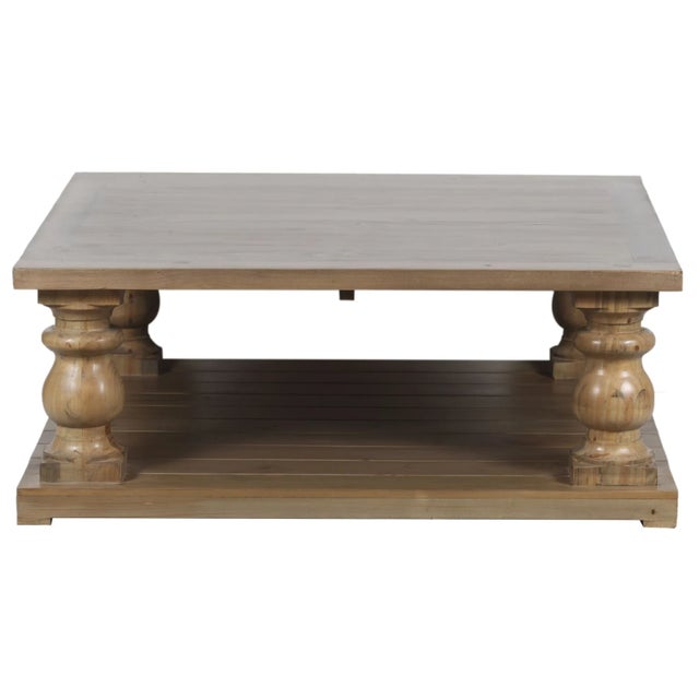 This oversized New Zealand Pine rustic coffee table features two tiers and chunky baluster legs, offering a solid wood...