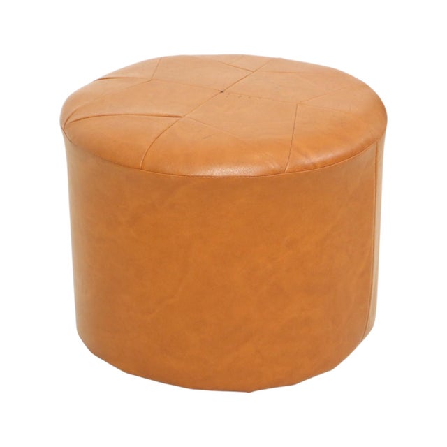 Cool vintage round pouf in patchwork style, made from a wooden base and upholstered in high-quality marbled light brown or...