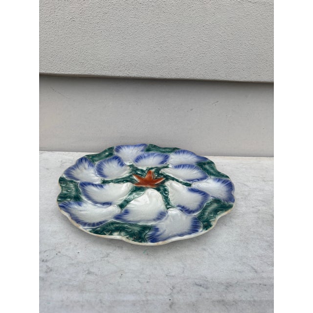 A very rare French Majolica oyster platter server with 12 shells on seaweeds, orange starfish on the middle Sarreguemines...