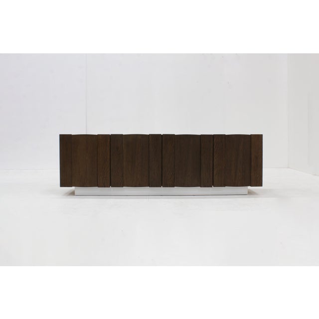 Vintage Brutalist sideboard from the 1970s in oak wood. Beautifully designed with a playful graphic panelled design. Low...