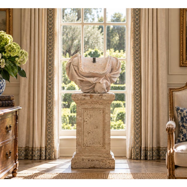 An evocative antique French carved marble female bust fragment, executed in the Neoclassical tradition and distinguished...