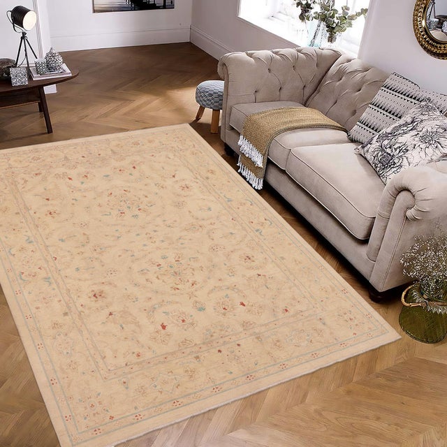 "Enhance the ambiance of your home with this magnificent Persian-influenced Turkish hand-knotted rug made by skilled...