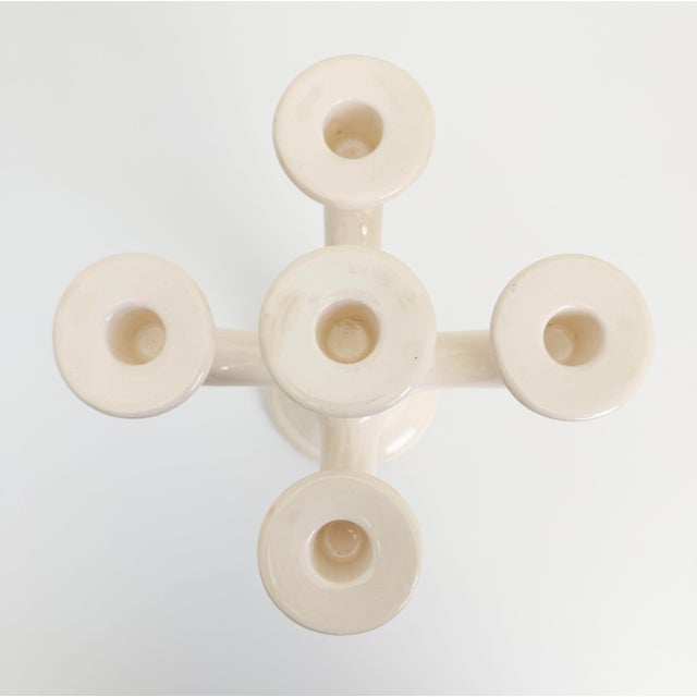 Scandinavian-style 5-arm candle holder made of ceramic, finished in a warm cream glaze with light crazing. Attributed to...