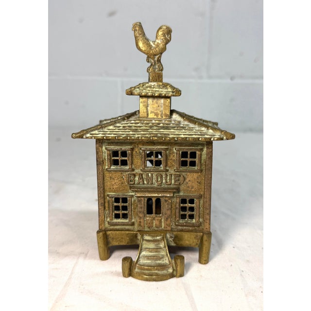 Up for sale is a rare antique French pagoda "Banque" coin still bank. Made of cast brass and originating from France, this...