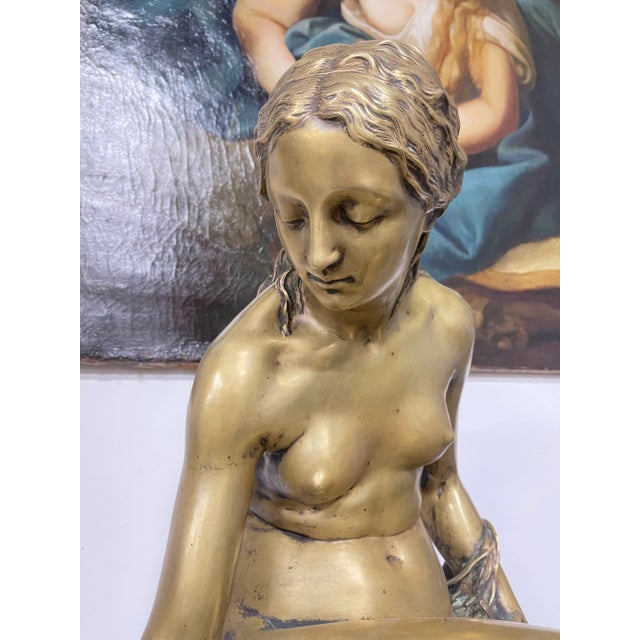 A FRENCH GILT BRONZE FIGURE OF A WATER NYMPH Late 19th century On marble base, bronze with foundry mark GRAUX MARLY FRERE...
