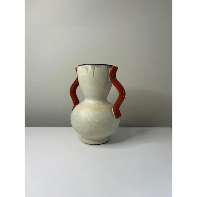 A rare ceramic vase designed by Anna-Lisa Thomson for Uppsala Ekeby, Sweden, circa 1940s. The vase features a graceful...