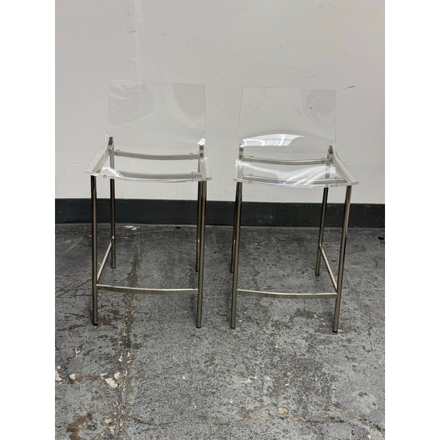 Design Plus Gallery presents a pair of Chiaro Clear Acrylic Counter Stools by Mermelada Estudio from CB2. These...