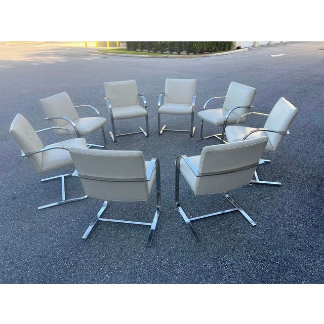 This is a set of 8 Flat Bar Brno Chairs, in the style of Mies van der Rohe in 1930. These particular examples of Knoll...