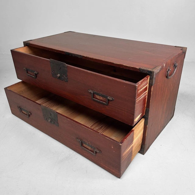Deep chestnut-brown chest with elegant hand-forged iron fittings and calm, well-balanced lines. Dimensions: height 45 cm,...