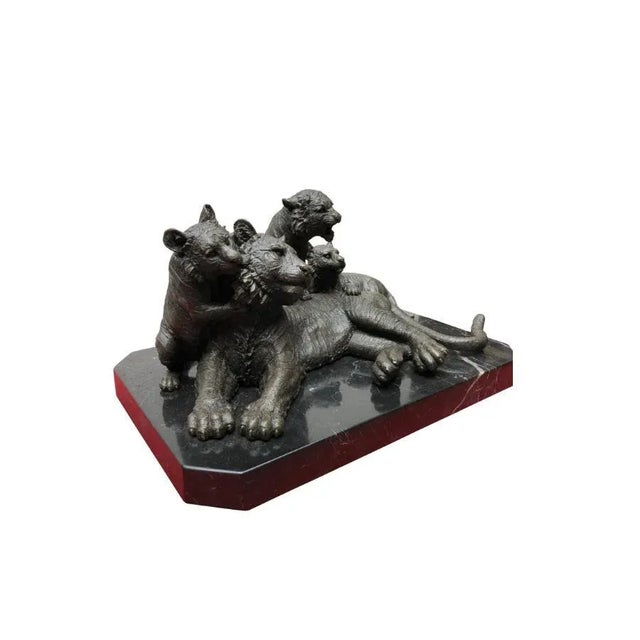 A gorgeous bronze casting of a tiger and her three cubs. Artist has really captured the energy to the scene with great...