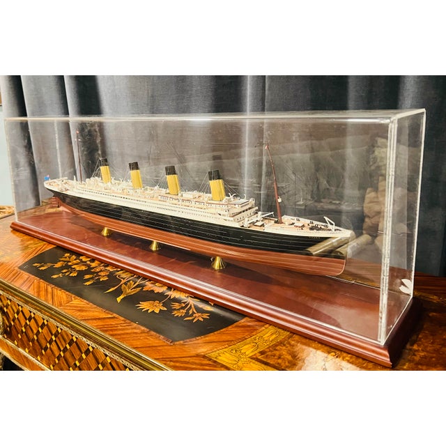A legendary ocean liner, captured in miniature with precision—history, craftsmanship, and drama in one striking display....