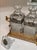 For your consideration. . . A rare vintage two bottle tantalus set in an ornate two handle footed case. This fabulous set...