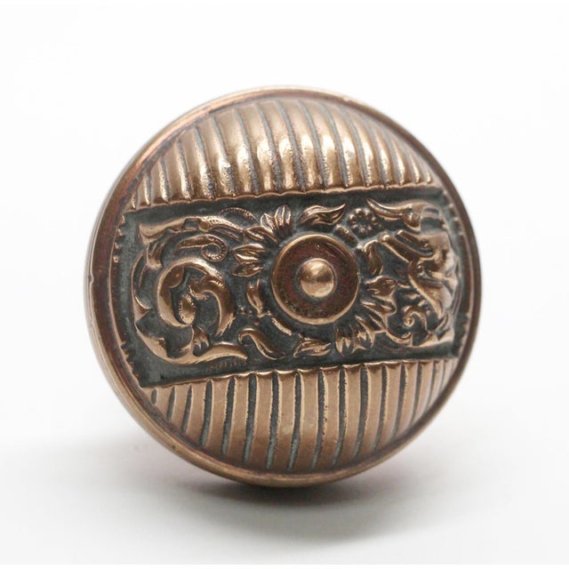 This Italian Renaissance style asymmetrical bronze entry door knobs were made by Reading in the 1890 catalog. It is part...