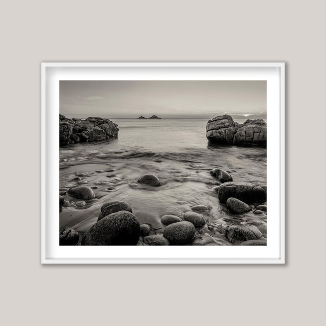 The Brisons at sunset, viewed from the beach at Porth Nanven, also known as Cot Valley, on the far western coast of...