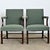 A sophisticated pair of large armchairs in the Georgian style, circa 1850, that exude a kind of regal confidence for...