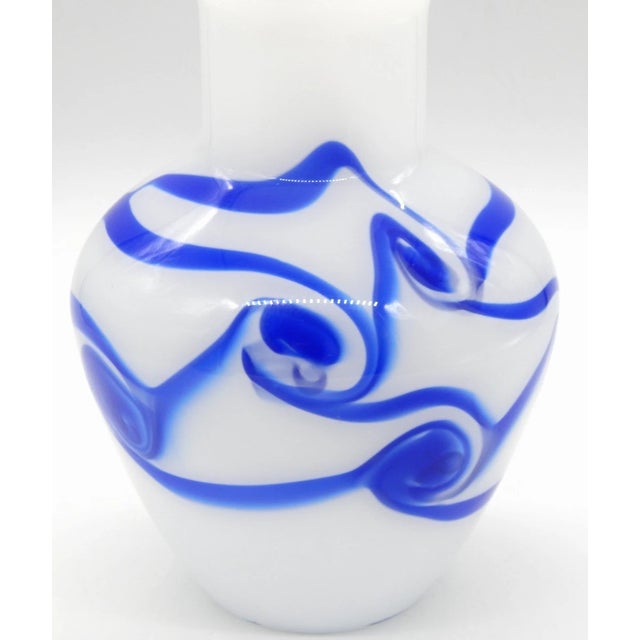 Striking vintage contemporary art glass vase inspired by classic Murano craftsmanship. This piece features an elegant...